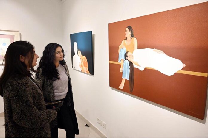 Art enthusiasts admire the stunning works displayed at the '9 in the Orion' painting exhibition at Gallery 6 in the Federal Capital