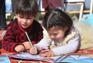 Children visitors busy in making drawing at a UNICEF painting stall during the closing ceremony of PDA Food & Culture Family Festival with the support of UNICEF at Regi Model Town Park