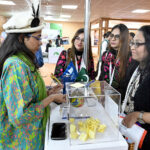 Women Visitor taking interest at Hotels & Resorts Pavilion stall during the Pakistan Travel Mart (PTM) 2025 at Expo Centre