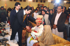 Provincial Minister for Communication and Law/Parliamentary Affairs, and Incharge of the "Dhi Rani" initiative, Malik Sohaib Ahmed, congratulates the bride and groom at a mass marriage ceremony organized under CM Punjab Maryam Nawaz Sharif's "Dhi Rani" initiative.