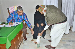 A doctor examining a patient during Orthopedic OPD Free Medical Camp at Bhitai Hospital.