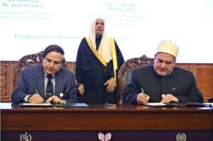 Secretary General of the Muslim World League, Sheikh Dr. Mohammed bin Abdulkarim al-Issa, witnesses Signing of International Partnership Agreements between Professor Dr. Sami Al-Sharif, Secretary General of the League of Islamic Universities with President of the international Islamic and Linguistics Universities, Dr Hussein Ibrahim Taha during Closing ceremony of the International Conference Girls Education at Jinnah convention Centre