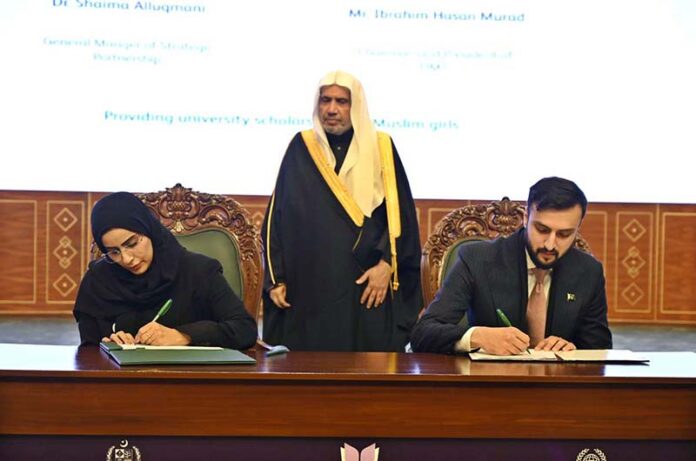 Secretary General of the Muslim World League, Sheikh Dr. Mohammed bin Abdulkarim al-Issa, witnesses Signing of International Partnership Agreements between General Manager of Strategic Partnership Dr. Shaima Allugmani with Chairman and President of UMT Ibrahim Hasan Murad during Closing ceremony of the International Conference Girls Education at Jinnah convention Centre