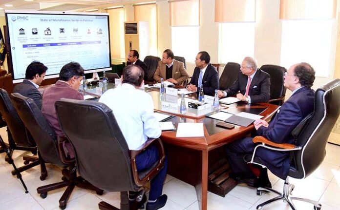 Federal Minister for Finance and Revenue, Senator Muhammad Aurangzeb, chairs a meeting with the leadership of the Pakistan Microfinance Investment Company (PMIC). The PMIC delegation led by Naveed A. Khan, Chairman PMIC