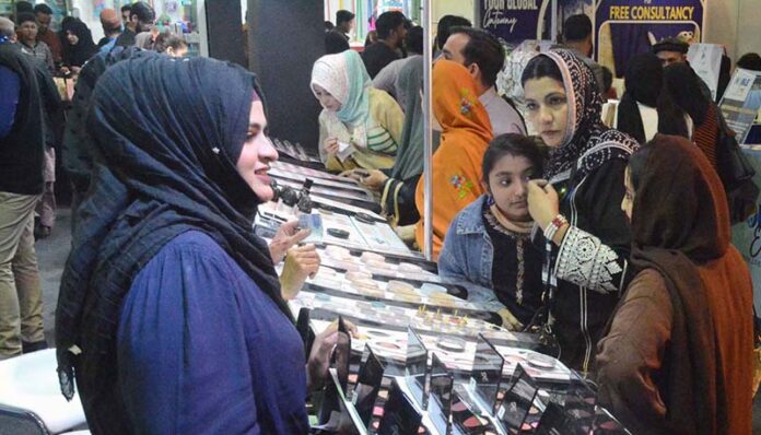 Visitors viewing products at Mera Brand Pakistan exhibition at Expo Centre