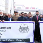 Barrister Danyal Chaudhry, Parliamentary Secretary for Information and Broadcasting, leading a walk on Bank Road, Saddar, to highlight the city's first walking street project aimed at enhancing pedestrian-friendly spaces