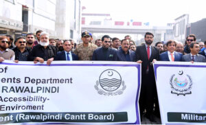 Barrister Danyal Chaudhry, Parliamentary Secretary for Information and Broadcasting, leading a walk on Bank Road, Saddar, to highlight the city's first walking street project aimed at enhancing pedestrian-friendly spaces