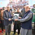 Defense Minister Khawaja Muhammad Asif is presenting a shield to Interior Minister & Chairman PCB Mohsin Naqvi at ceremony to celebrate the victory of Sialkot Cricket Team in the Quaid-e-Azam Trophy 2024-25