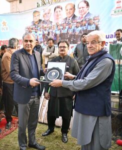 Defense Minister Khawaja Muhammad Asif is presenting a shield to Interior Minister & Chairman PCB Mohsin Naqvi at ceremony to celebrate the victory of Sialkot Cricket Team in the Quaid-e-Azam Trophy 2024-25