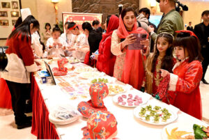 Ambassador of China to Pakistan Jiang Zaidong and Special Assistant to the Prime Minister on Foreign Affairs, Syed Tariq Fatemi along with other dignitaries in a group photo with the participants during the ceremony organized on “Chinese New Year 2025, We Celebrate Together” at the Embassy of the People's Republic of China