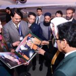 Ms Nargis Shaziya Chaudhary, Director HP, Press Information Department presenting a photo album to Secretary General of Muslim World League H.E. Dr. Mohammad bin Abdulkarim Al-Issa on the completion of his Pakistan visit at the Islamabad Airport