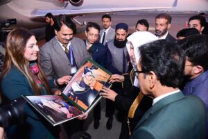 Ms Nargis Shaziya Chaudhary, Director HP, Press Information Department presenting a photo album to Secretary General of Muslim World League H.E. Dr. Mohammad bin Abdulkarim Al-Issa on the completion of his Pakistan visit at the Islamabad Airport