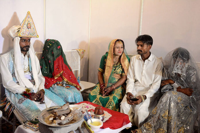 106 Hindu couples tie the knot at a mass wedding ceremony organized by the Pakistan Hindu Council at Railway Ground