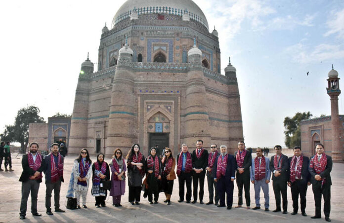 Officers of the National Institute of Public Administration (NIPA) pose for a group photo during their visit to the shrine of Shah Rukn-e-Alam
