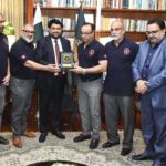 Governor Sindh, Kamran Tessori presents a shield to the president and CEO of the Canadian Police Cricket Club during their visit to the Governor House in the provincial capital