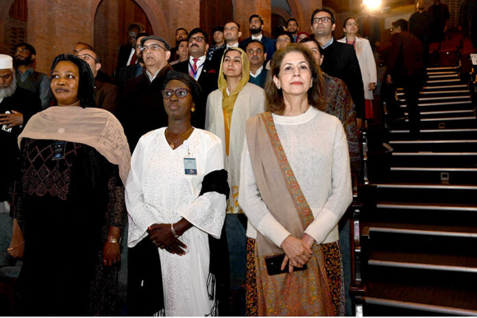 Secretary Information and Broadcasting Ambreen Jan along with delegates of the International Conference on Girls’ Education standing in respect of national anthem at the Cultural Evening, honoring the delegates at PNCA