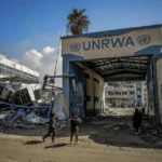 Israel forcing UNRWA to remove logo, hand over aid supplies, official says