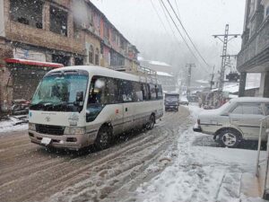 A view of snow covered area during snowfall in the city during morning time.