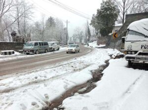 A view of snow covered area during snowfall in the city during morning time.