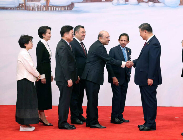 Chinese President Xi Jing Ping welcoming President Asif Ali Zardari, along with others heads of states/governments upon their arrival, at the state banquet before the opening ceremony of the 9th Asian Winter Games 2025