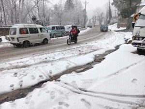 A view of snow covered area during snowfall in the city during morning time.
