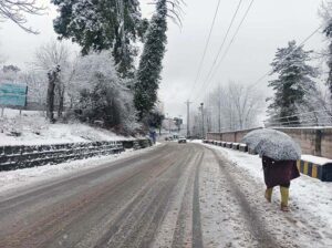 A view of snow covered area during snowfall in the city during morning time.