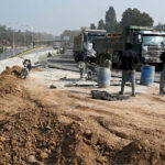 Labourers busy in construction work of Serena Chowk Interchange Project during development work in the Federal Capital