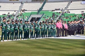 Players of Pakistan and New Zealand cricket teams standing in respect of national anthems of both countries before start of the first match of Tri-Nation Series at Gaddafi Stadium