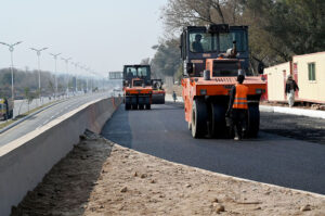 Labourers busy in construction work of Serena Chowk Interchange Project during development work in the Federal Capital