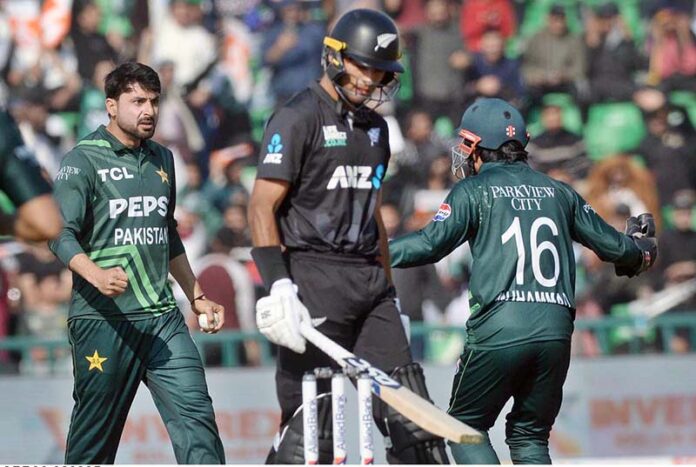 Pakistani bowler Abrar Ahmed celebrates after taking the wicket of New Zealand batsman Rachin Ravindra during first match of Tri-Nation Series played between Pakistan and New Zealand cricket teams at Gaddafi Stadium