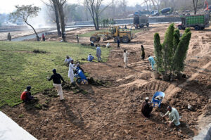 Labourers busy in construction work of Serena Chowk Interchange Project during development work in the Federal Capital