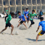 Football players in action during Sindh darya games 2025 organized by sports and youth affair department at bank of Indus River