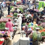 A large number of vendors selling fresh vegetables at Jelas Market Chowk