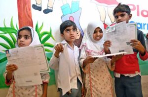 Disabled children standing in queue for registration at the Special CNIC Camp organized in collaboration with NADRA at Rehabilitation Centre of Multiple Handicapped Children.