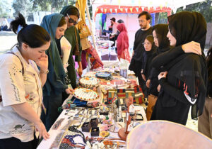 Women visiting stalls during Faiz Mela at Al-Hamra