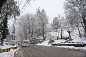 A beautiful view of road covered with snow during a heavy morning snowfall in the city.