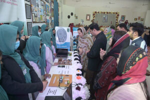 Women explore a fabric stall to purchase a beautiful outfit for them at the Exhibition of Govt. College of Technology for Women, Sargodha