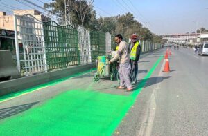 Staffers of Rawalpindi Development Authority (RDA) marking the dedicated bike lane on Old Airport Road.