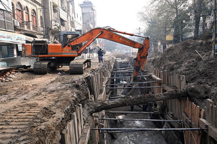Labourers use heavy machinery at Naba Road as part of a major development project in the Provincial Capital