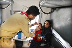 A lady health workers administer polio drops to a gypsy child in Latifabad during to the National Anti-Polio Campaign 2025.
