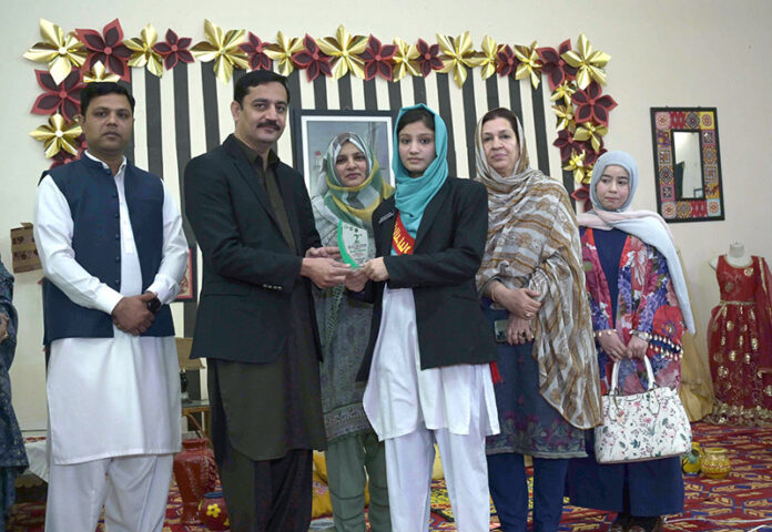 President Chamber of Commerce Khawaja Yaser Qayom and Principal GCTW award shields to position holders of Punjab Board of Technical Education during the Project Exhibition at Govt. College of Technology for Women
