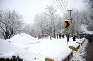 A beautiful view of road covered with snow during a heavy morning snowfall in the city.