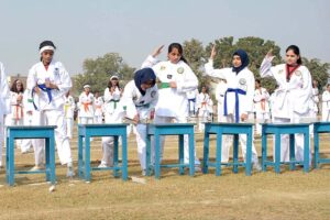 Students are participating in the Chati Race during annual sports event at Multan Public School.