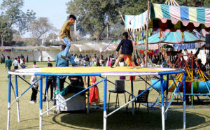Students enjoy on the Jumping jack during the spring festival at La Salle Higher Secondary School
