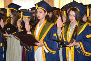 Successful graduate students showing their degrees during 22nd convocation of ISRA University