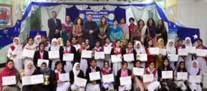 Director Colleges Sher Ahmed Satti and Professor Dr. Fariha Nighat pose for a group photo with position-holding students during the prize distribution ceremony at Government college Dhok Elahi Baksh.