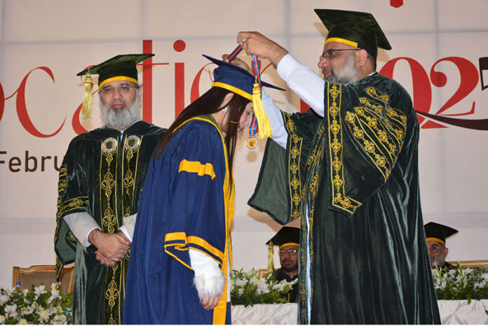 ISRA Islamic foundation President Prof. Dr. Hamidullah Qazi is giving away Gold medal among to the successful graduate student during 22nd convocation of ISRA University