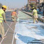 Labourers are busy preparing the green tracks for motorcyclists at the General Bus Stand