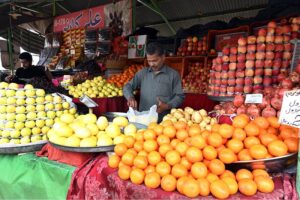A vendor displays a variety of fruits, commonly used in fruit salads, a staple on the menu for breaking fast during the holy month of Ramdan, attracting customers at H-9 Weekly Bazar.