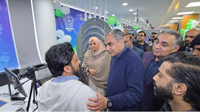 Federal Minister for Interior Mohsin Naqvi inaugurating new passport office at NADRA Center on Peco Road